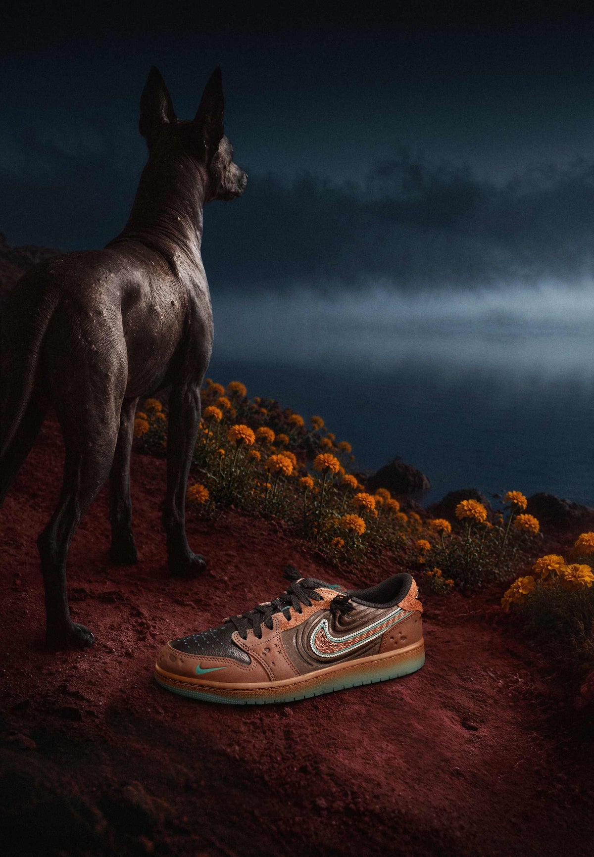 Air Jordan 1 Low OG Somos Historias in brown leather and shaggy suede on red dirt beside a Xoloitzcuintle dog and orange marigolds, from Nike SNKRS Mexico