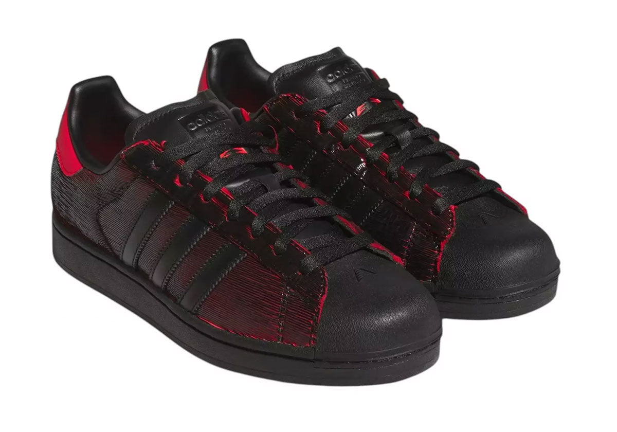 Anthony Edwards x adidas Superstar Halloween KZ9164 in black and red. Official adidas image via Sneaker News