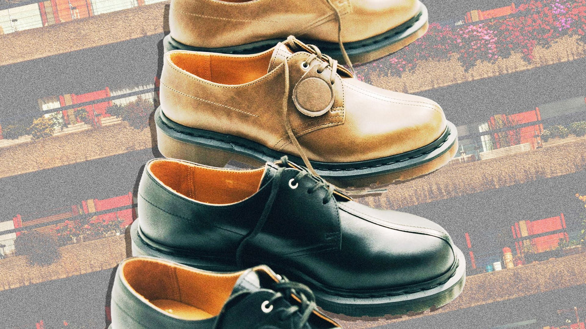 Dr. Martens × Sage Nation 1461 campaign key visual — clove green and black pairs on architectural scene, courtesy Dr. Martens
