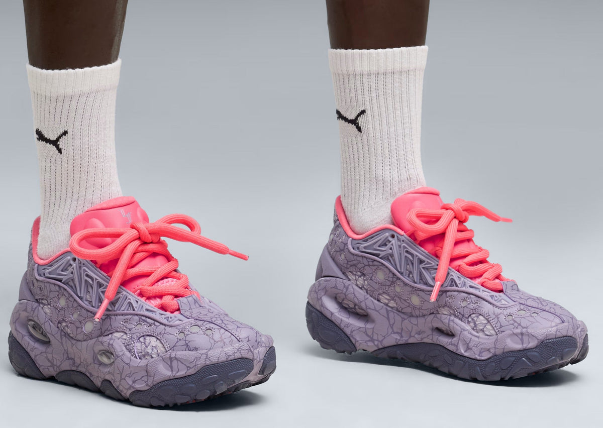On-foot shot of the PUMA LaFrance RNR Stranger Things in cracked purple with hot pink laces and white PUMA socks. Photo via Sole Retriever