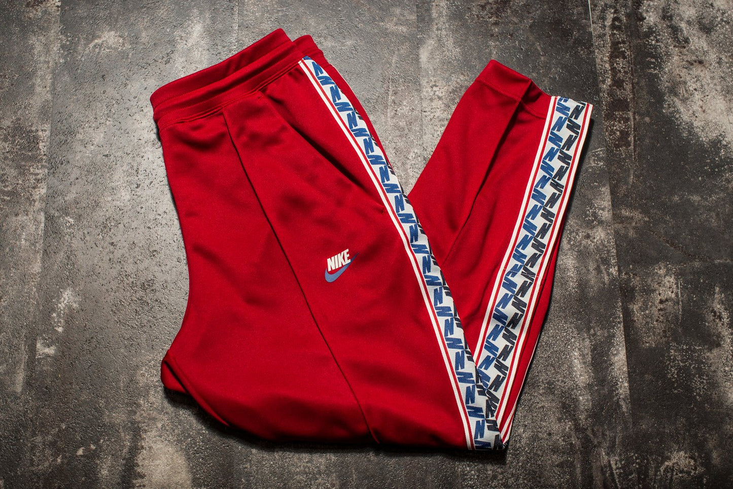 Nike Sportswear Taped Poly Pants, laid flat