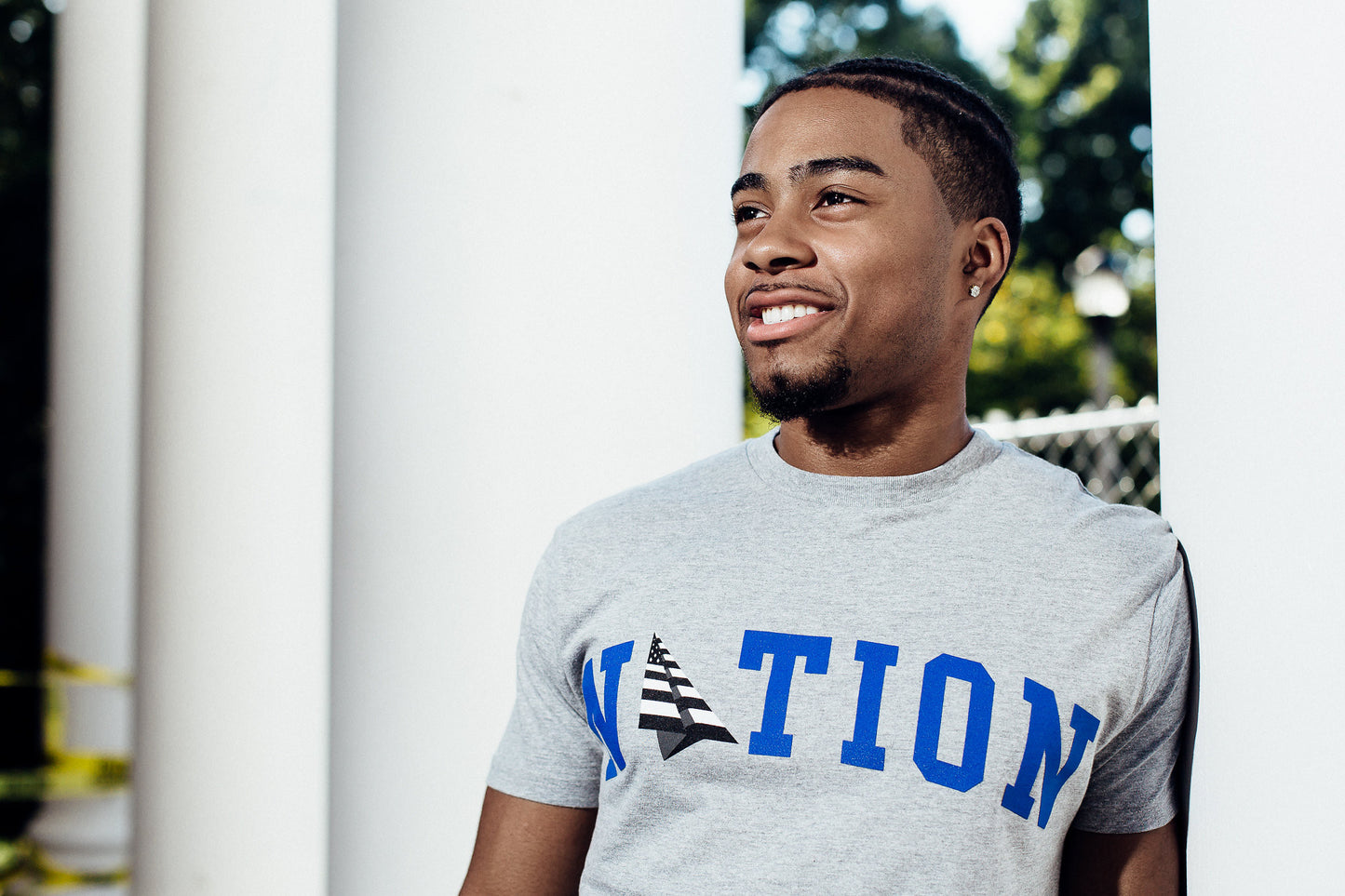 Roc Nation x Oneness Nation Tee, worn by a model outdoors