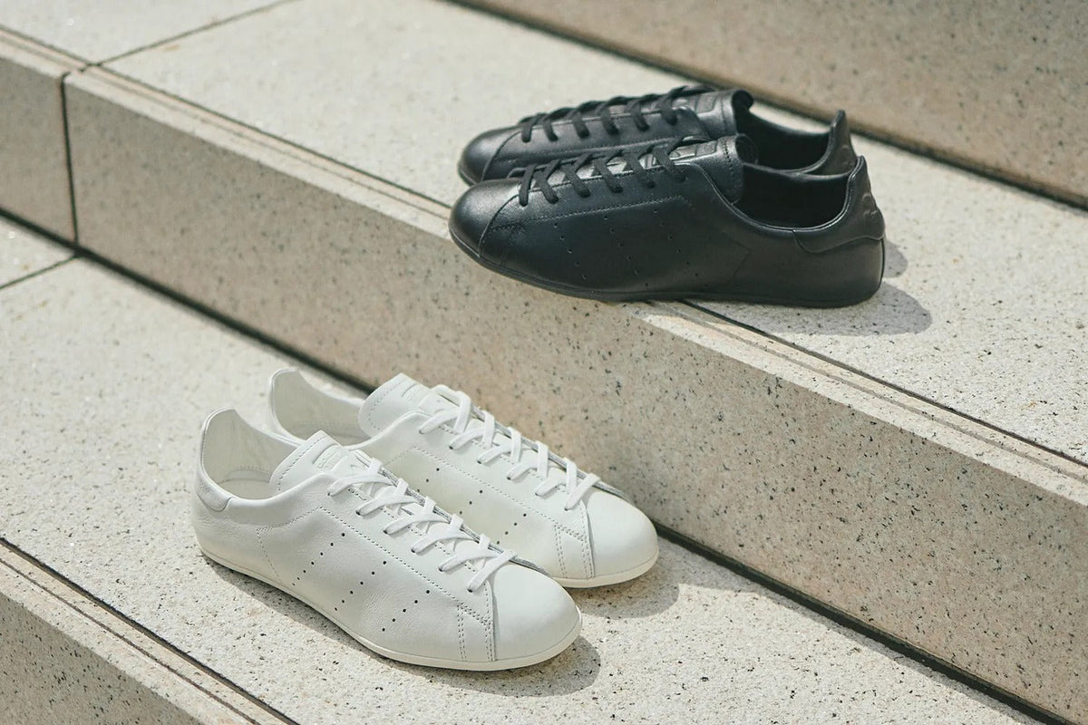 adidas Originals for BILLY'S Stan Smith Lo Pro — black and white pairs on stone steps