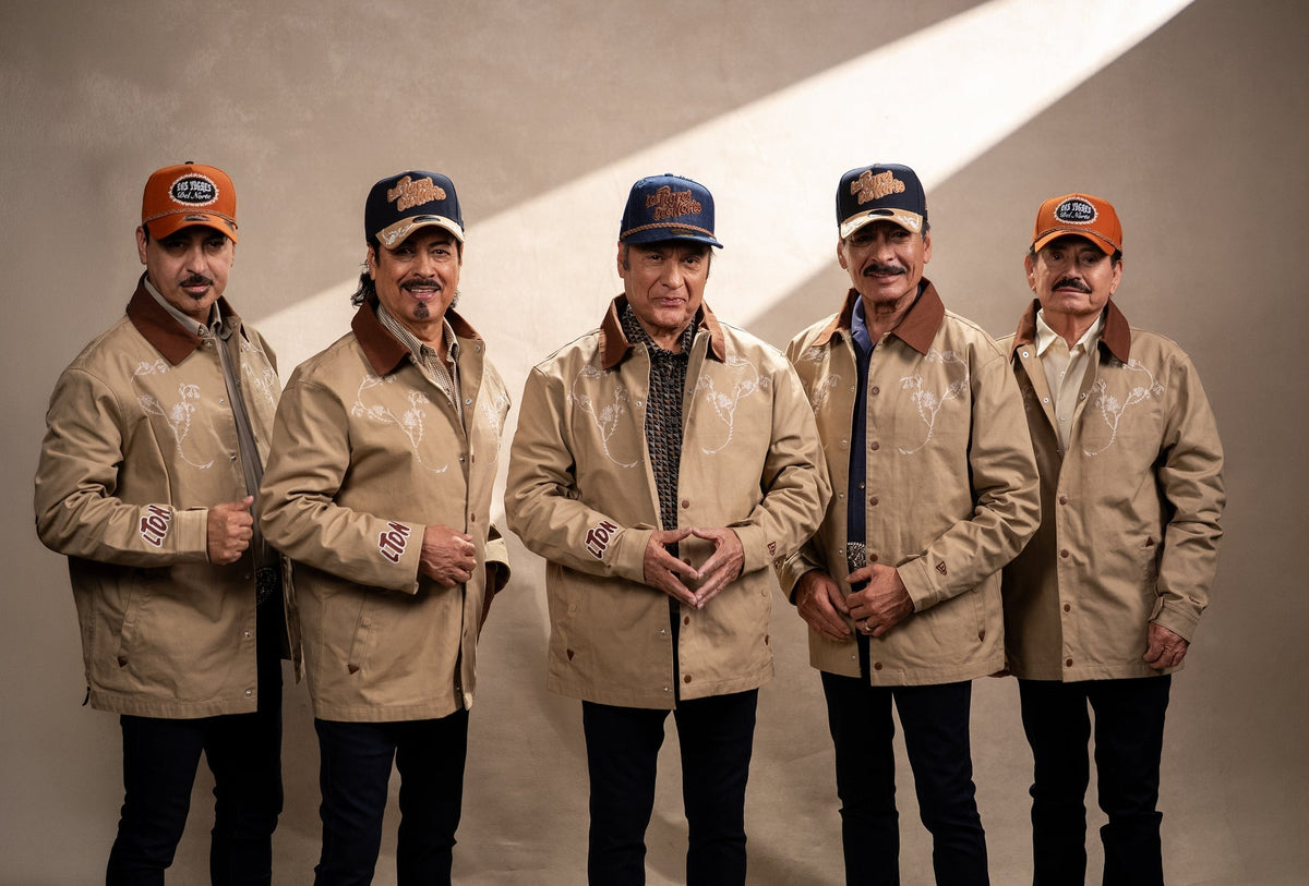 Los Tigres del Norte in New Era collab chore jackets and caps — official campaign