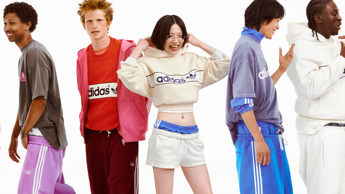 adiSignature by adidas Originals FW26 campaign: five models in colorful hoodies, crewnecks and Three Stripes track pants. Official adidas image via WWD
