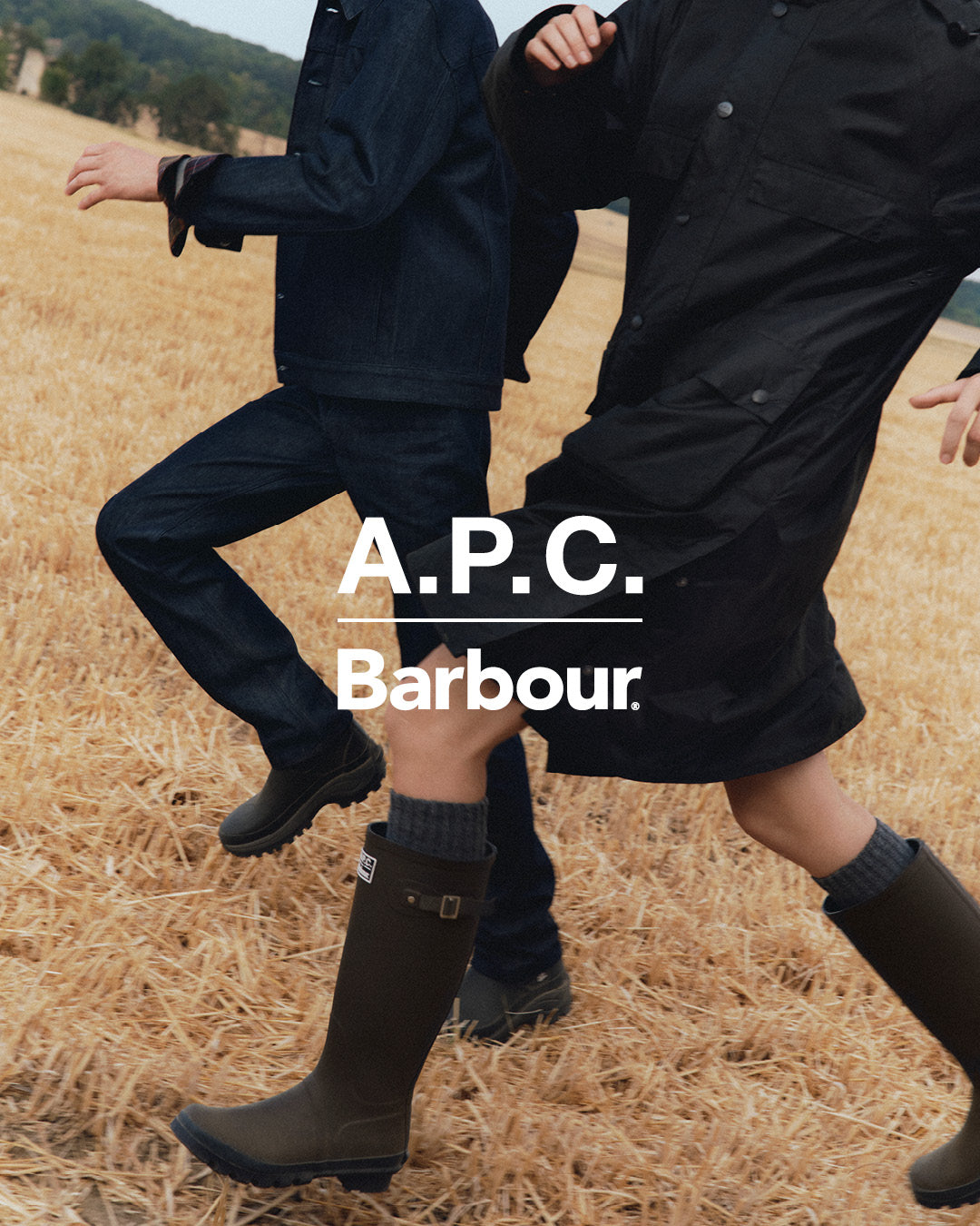 A.P.C. x Barbour FW26 campaign: models running through a wheat field in the collab denim jacket, wax jacket and Wellington boots — official A.P.C.