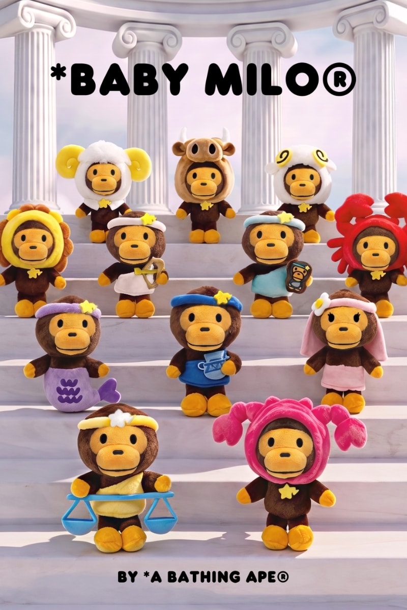 BABY MILO plush figures dressed as the 12 zodiac signs, including a ram, a bull, a crab, a lion and a figure holding Libra's scales, lined up on marble temple steps for the FW26 Zodiac Blind Box Series. Image via Hypebeast