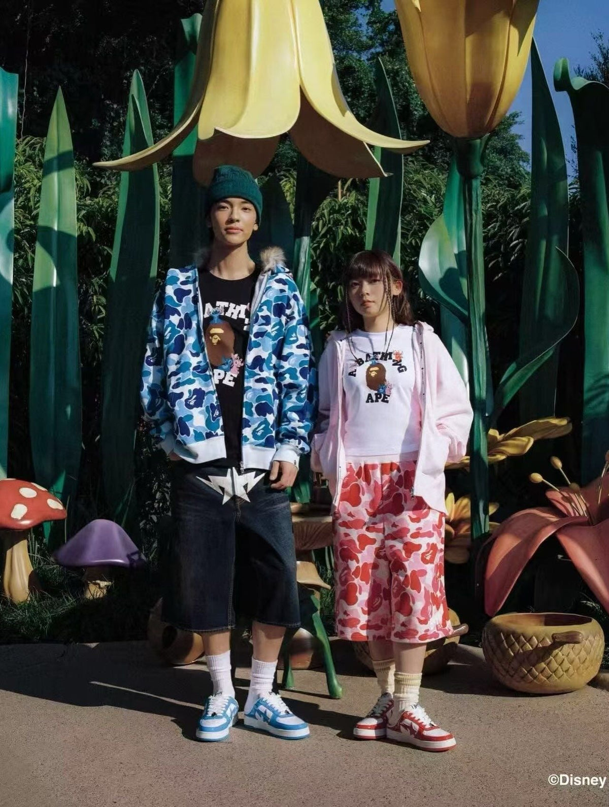 BAPE × Disney Stitch campaign — models in ABC camo at oversized garden set, courtesy BAPE/Disney