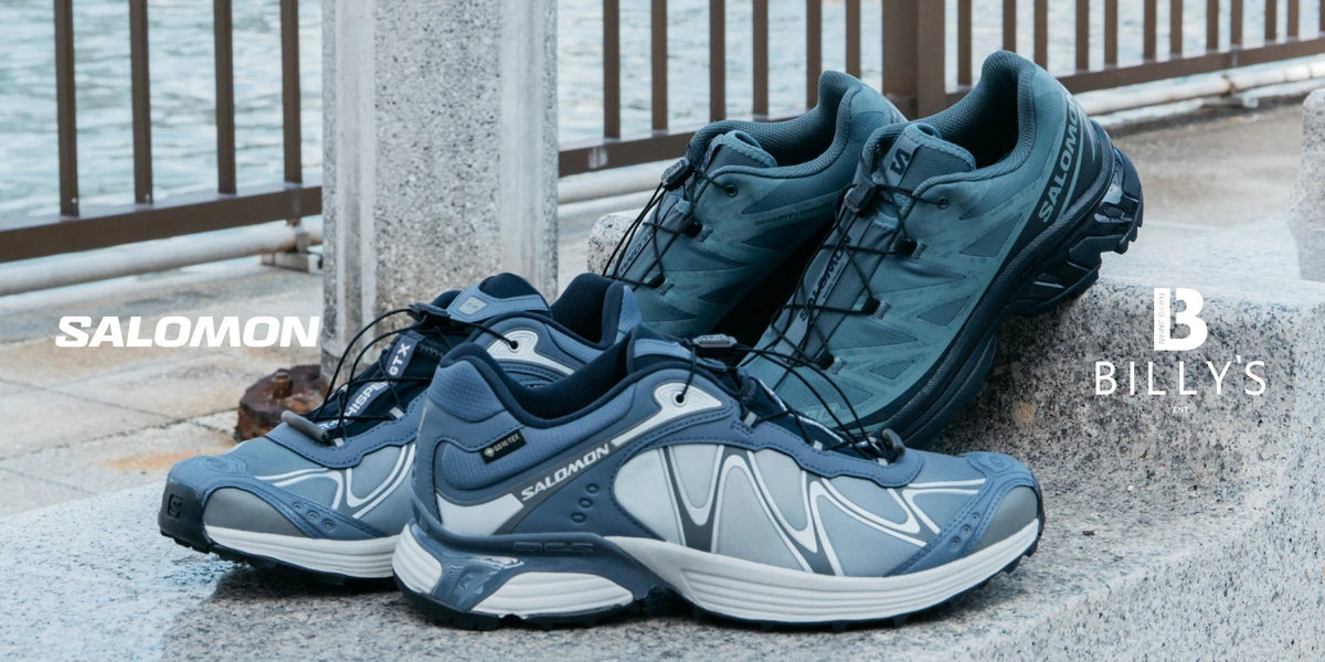 Salomon XT-WHISPER GORE-TEX Grisaille and XT-6 PROTECTIVE Stormy Weather BILLY'S exclusives on a granite ledge by the water. Photo via BILLY'S ENT
