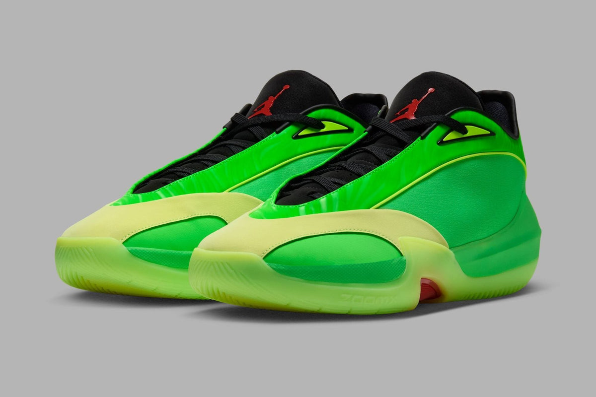 Pair of Jordan Triangle "Paolo" IQ5570-300 in Rage Green and Barely Volt with a black collar and red Jumpman. Photo via Nice Kicks