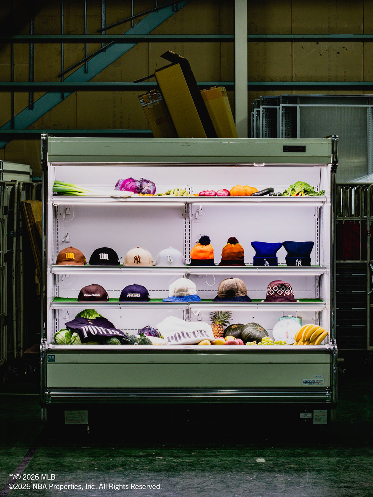 New Era Japan Powered by GORO × MIN-NANO caps and apparel staged in a produce fridge — New Era Japan campaign