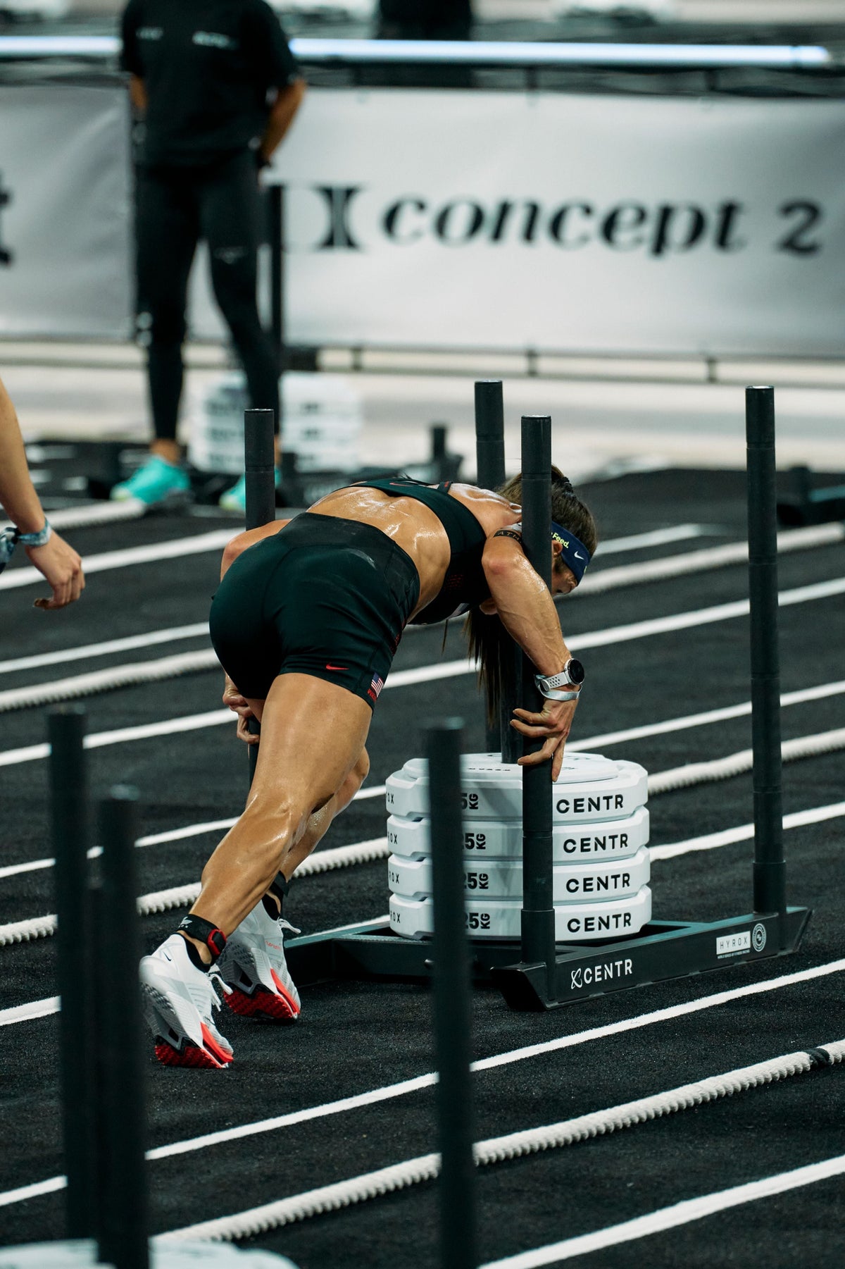 Lauren Weeks pushes a HYROX sled in Nike Hybrid footwear — official Nike newsroom