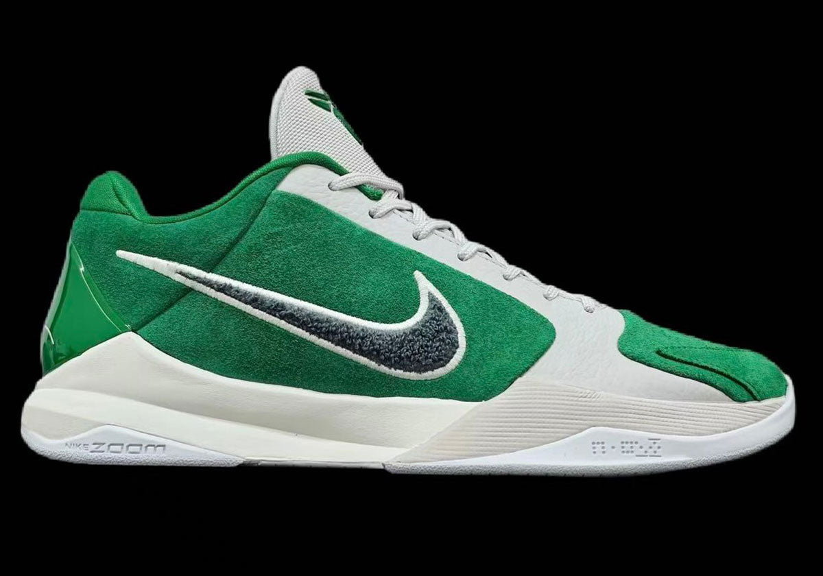 Side view of the Nike Kobe 5 Protro Eagles JF1792-300 in Pine Green suede with a dark grey chenille Swoosh and Vast Grey toe. Image via Sneaker News