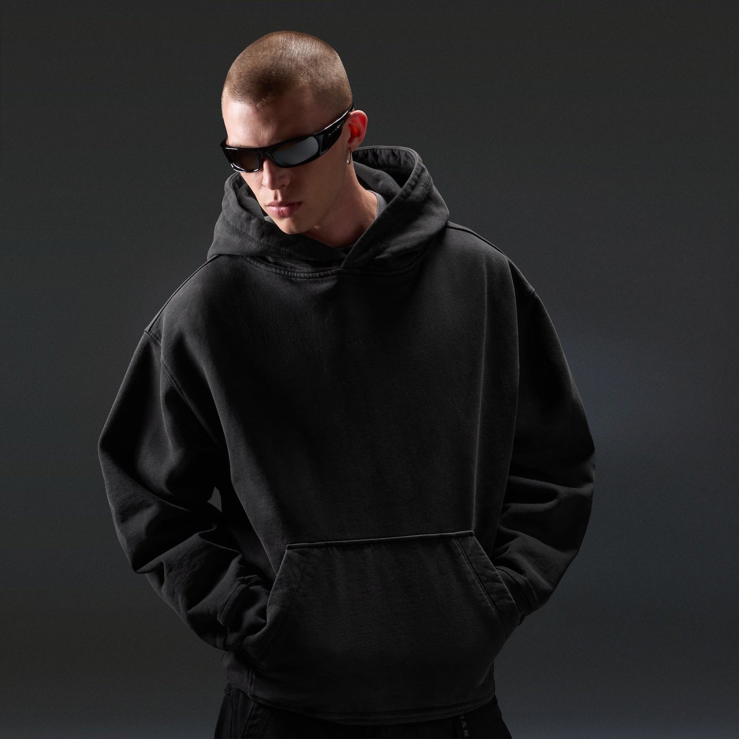 Oakley Echo Mod Embroidered Hoodie in Pitch Black, men's black hoodie on model, view 4