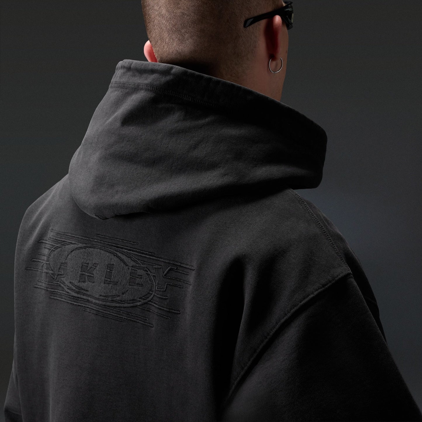 Oakley Echo Mod Embroidered Hoodie in Pitch Black, men's black hoodie on model, view 5