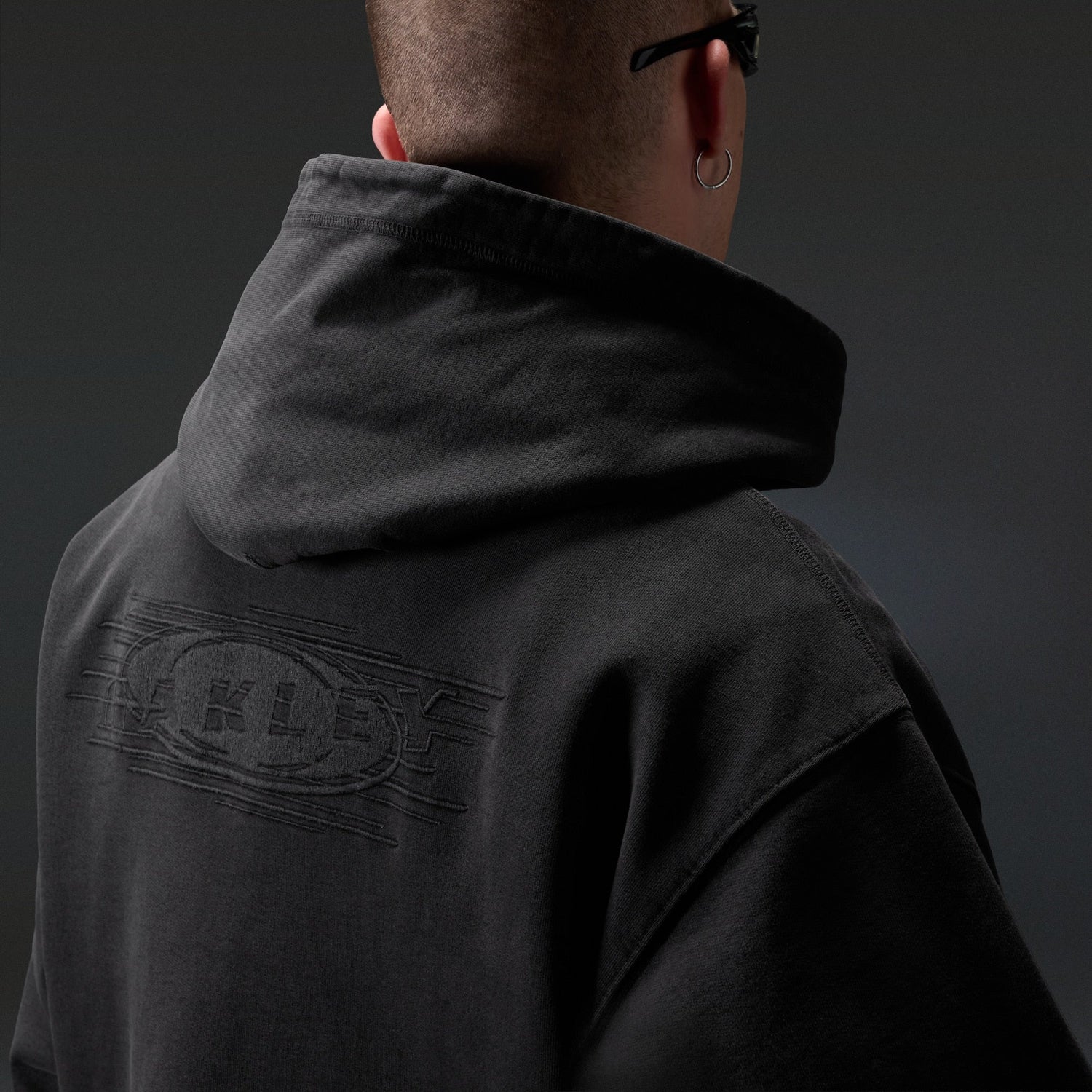 Oakley Echo Mod Embroidered Hoodie in Pitch Black, men's black hoodie on model, view 5