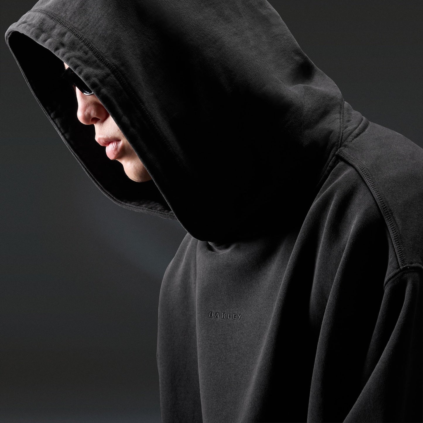 Oakley Echo Mod Embroidered Hoodie in Pitch Black, men's black hoodie on model, view 6