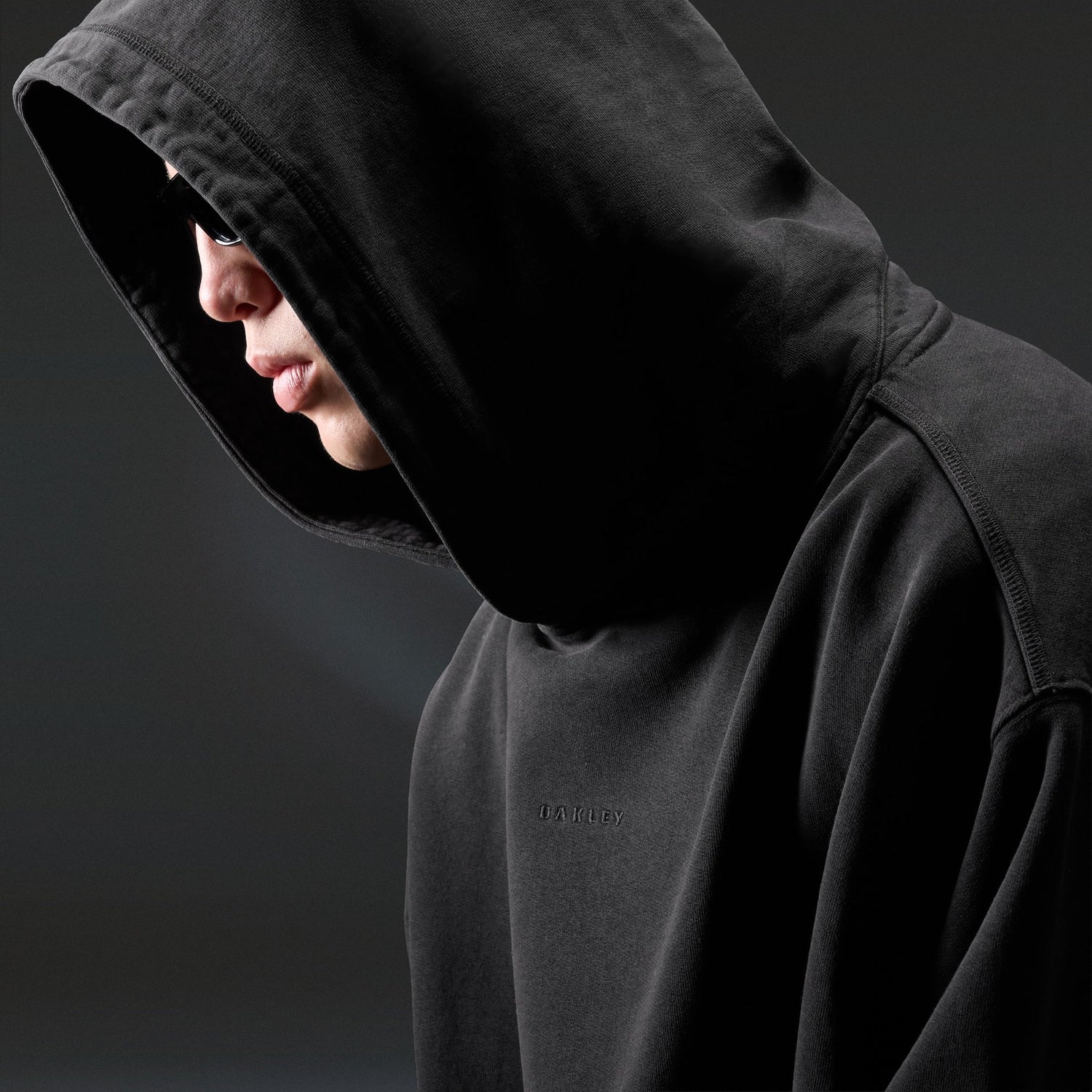 Oakley Echo Mod Embroidered Hoodie in Pitch Black, men's black hoodie on model, view 6