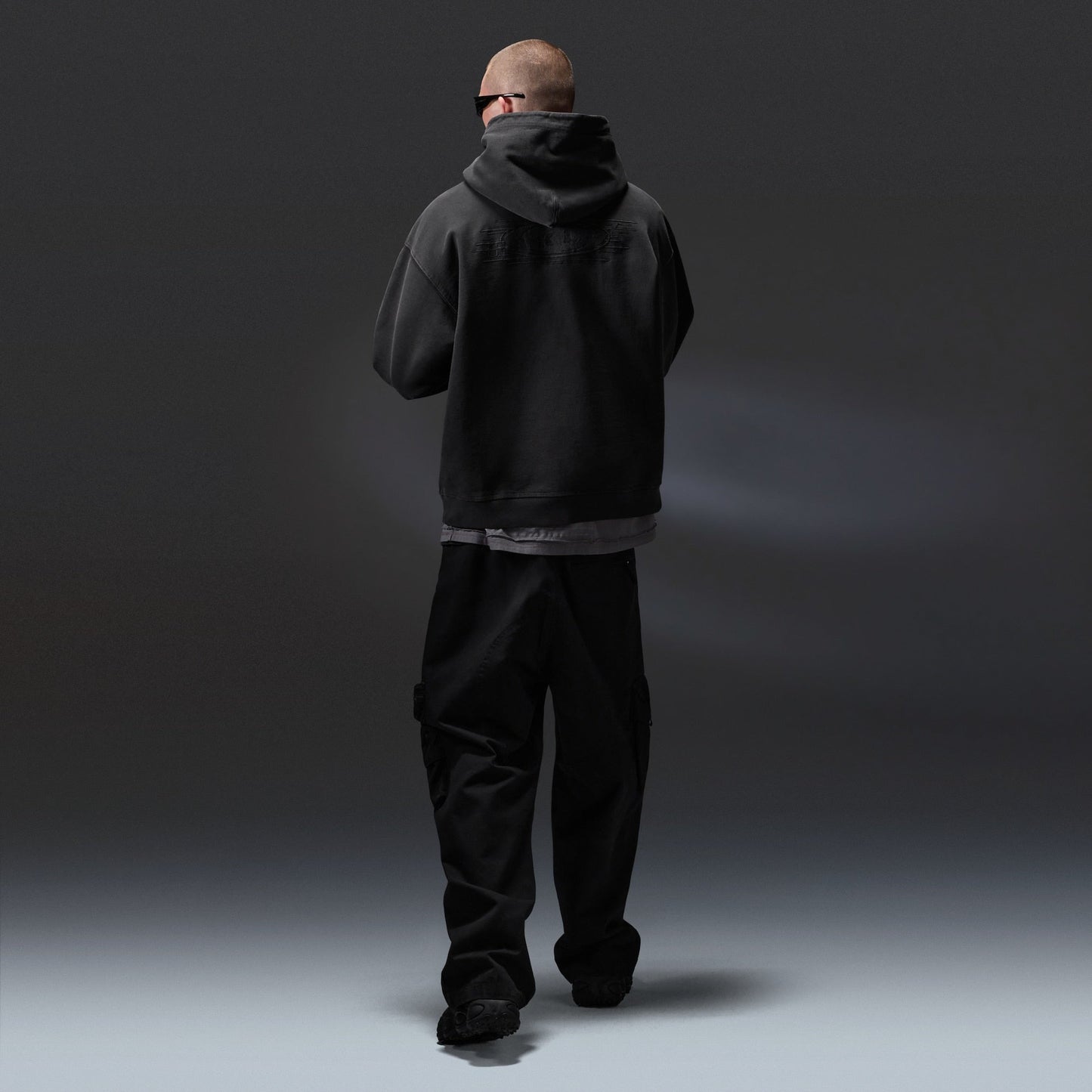 Oakley Echo Mod Embroidered Hoodie in Pitch Black, men's black hoodie on model, view 7