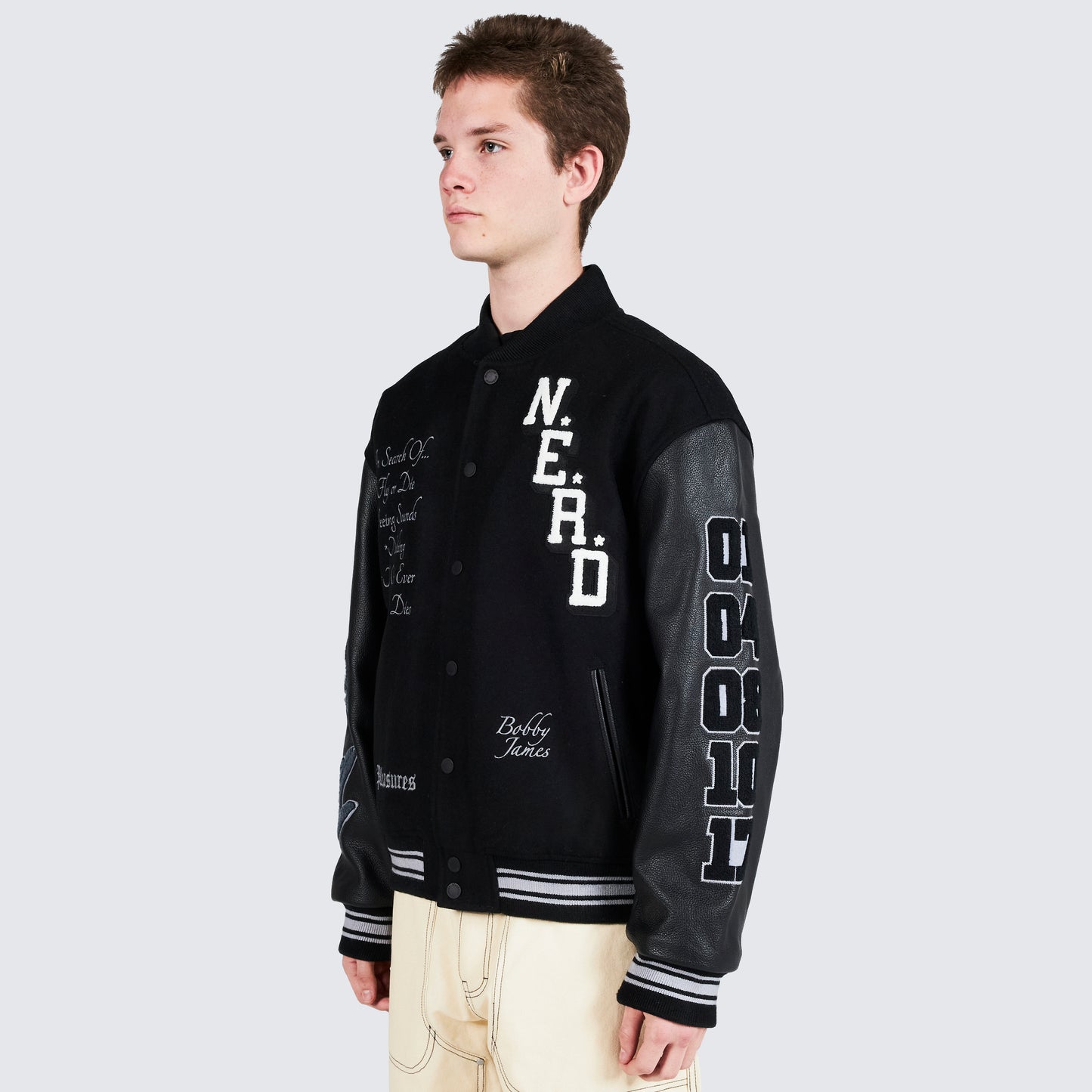 Chaqueta universitaria NERD de Pleasures en negro