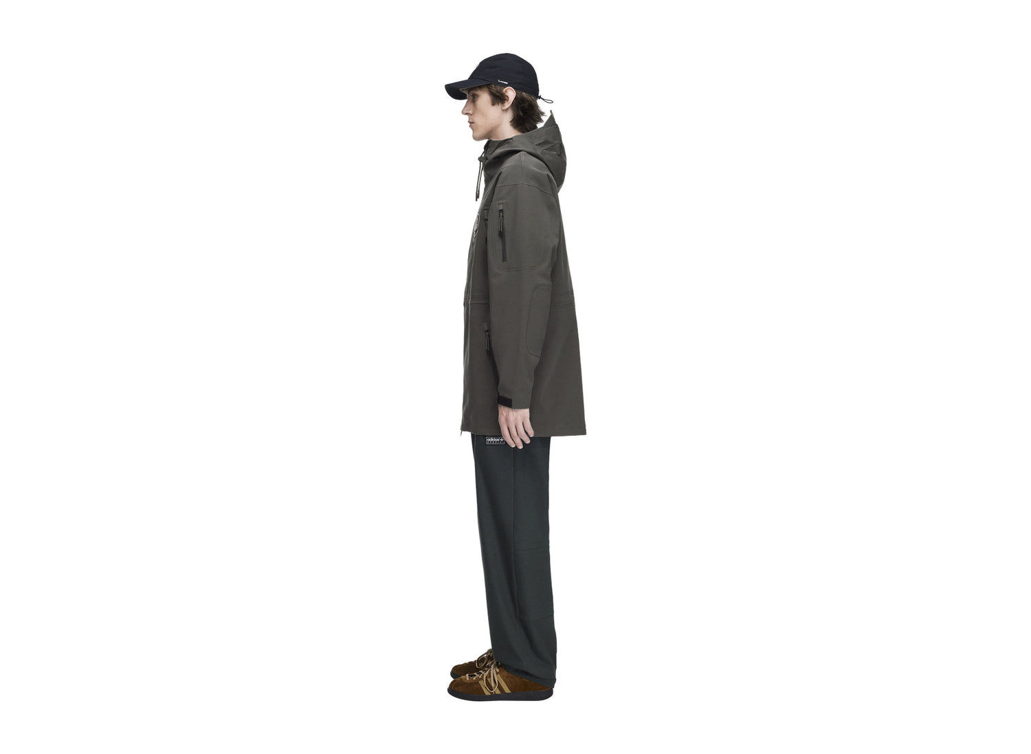 Adidas Springvale SPZL Parka in Legend Earth — on model side view