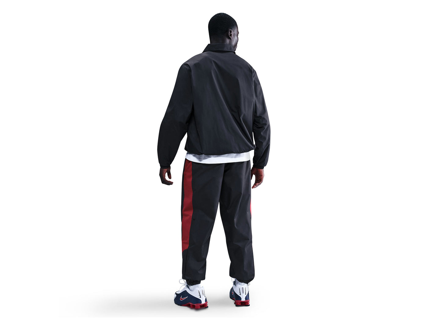 Nike Windrunner gefütterte Hose in Schwarz / Team Crimson