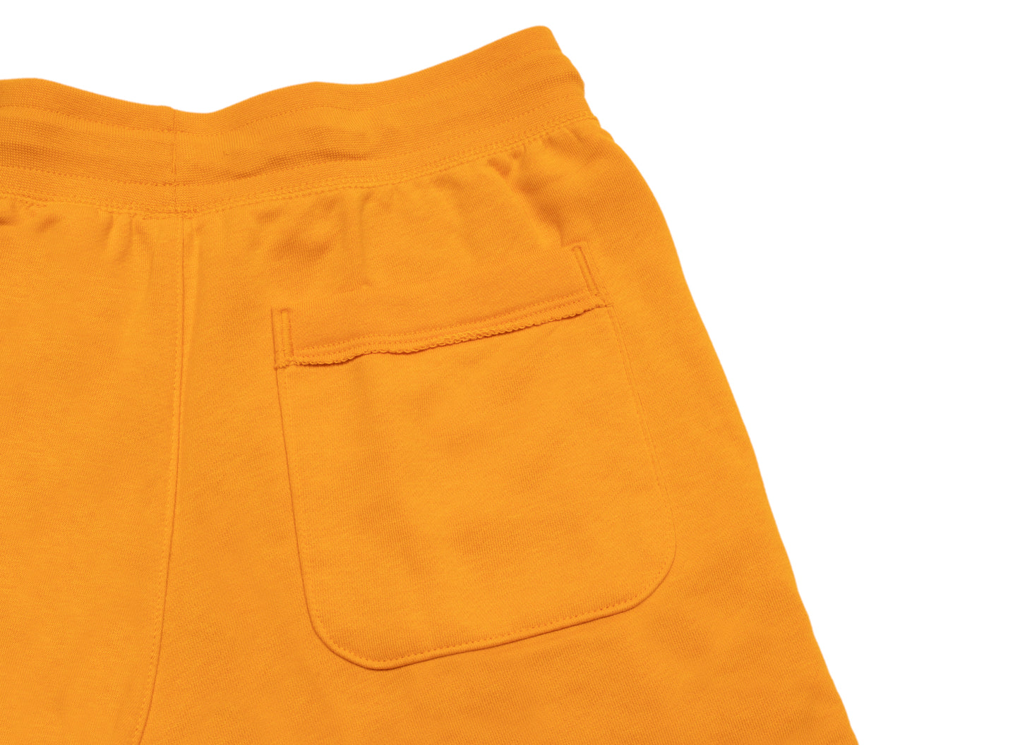 Nike Sportswear Essentials Alumni Shorts in Kumquat